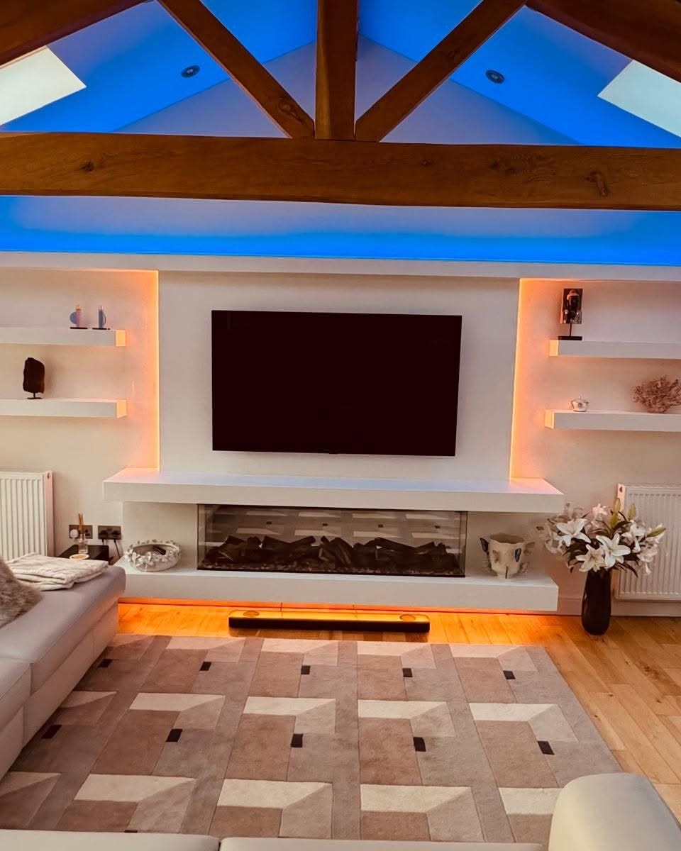 Barn-style lounge with media wall, fireplace and ambient shelving